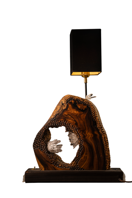 A table lamp with an wood carving